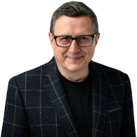 Blue_Jacket_SQ Professional headshot of executive advisor Nigel Thurlow, former Toyota leader and organizational performance consultant.