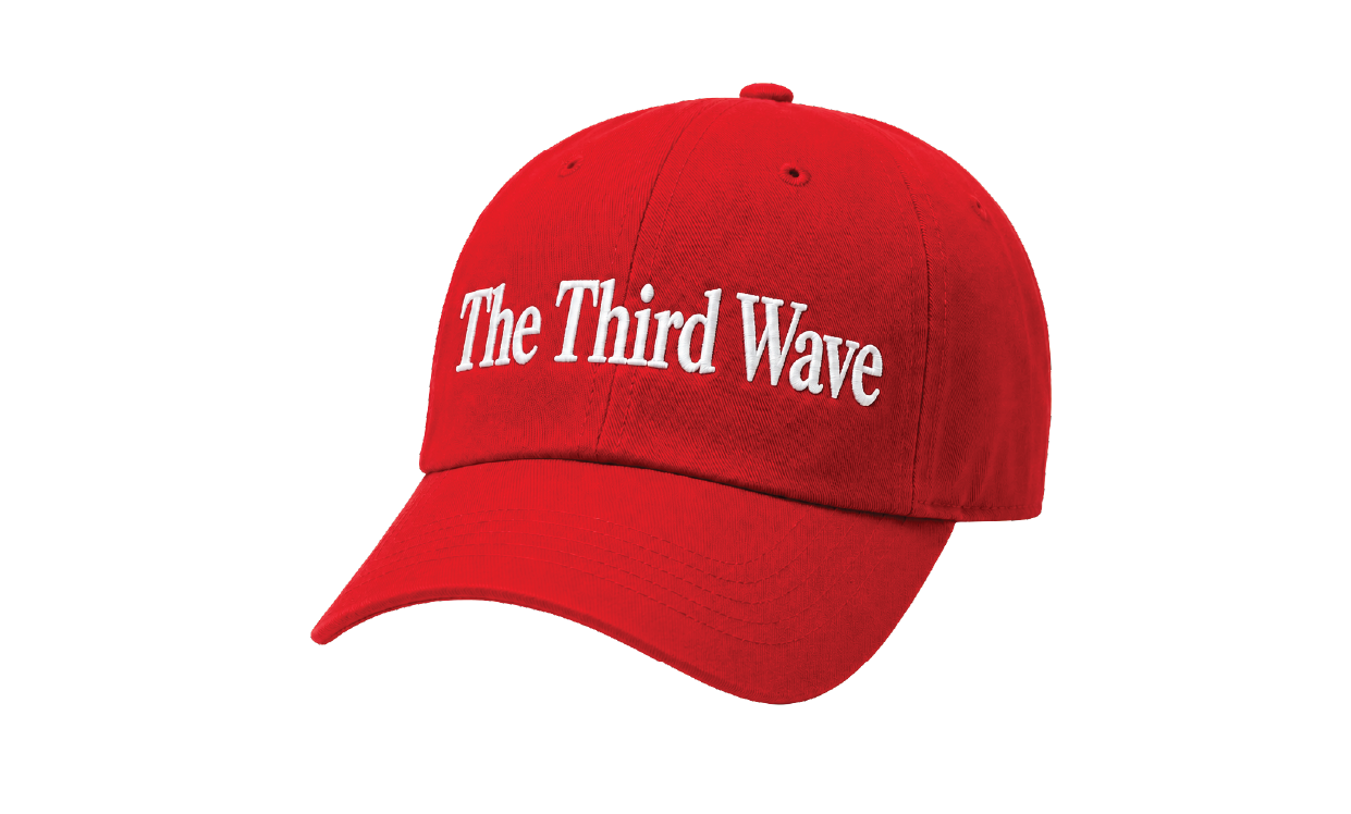 A red baseball cap with the slogan "The Third Wave"